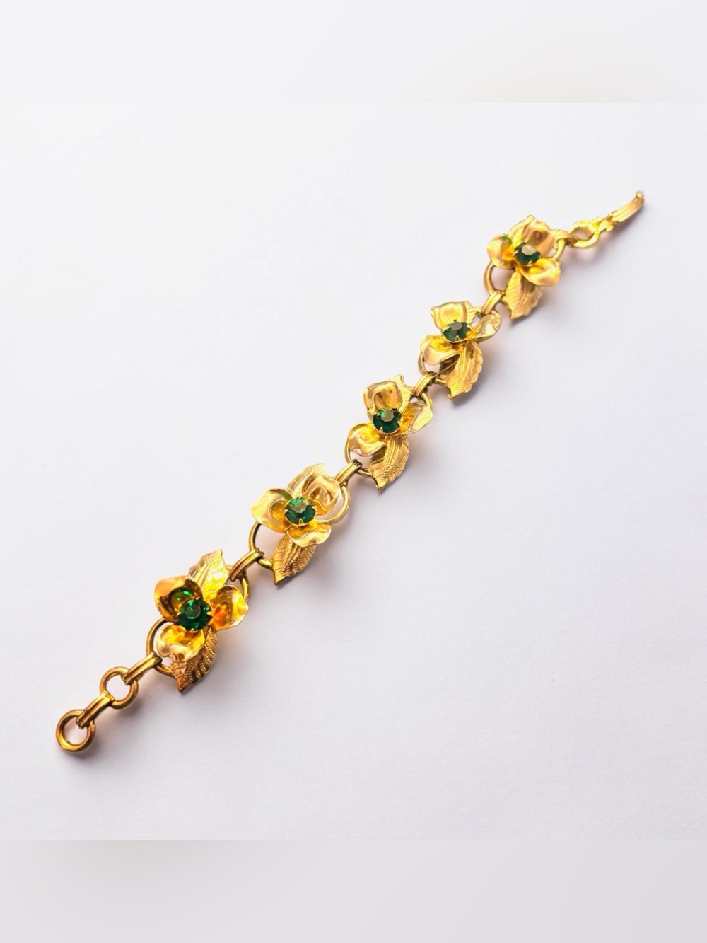 Gold-tone Floral Bracelet with Green Gem Accents